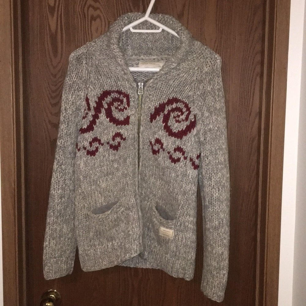 Grey sweater.  Golden by TNA